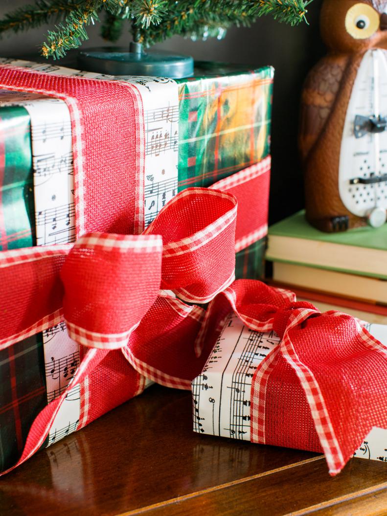 Put a new spin on old sheet music by using it as gift wrapped accents. Mixing the black and white sheets with colored or patterned wrapping paper strikes up a perfect balance.