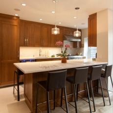 Warm Contemporary Kitchen With Dining Peninsula