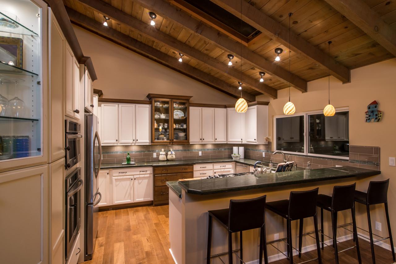 Spacious Kitchen With Country Accents and Vaulted Wood ...