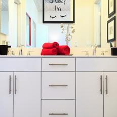 White Cabinets Under Double Vanity in Yellow Bathroom