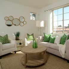 Elegant Transitional Living Room With Neutral Furniture, Bright Green Accents and Natural Wood Coffee Table With Nailhead Embellishment