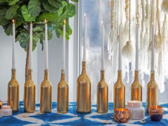 modern menorah made with gold spray painted bottles
