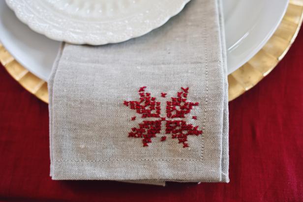 Add some modern folk to your holiday table with cross-stitched poinsettia napkins.