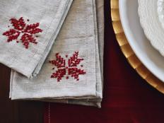 cross stitched poinsettia napkins