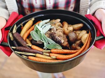 a pot of hard cider roast with fresh vegetables