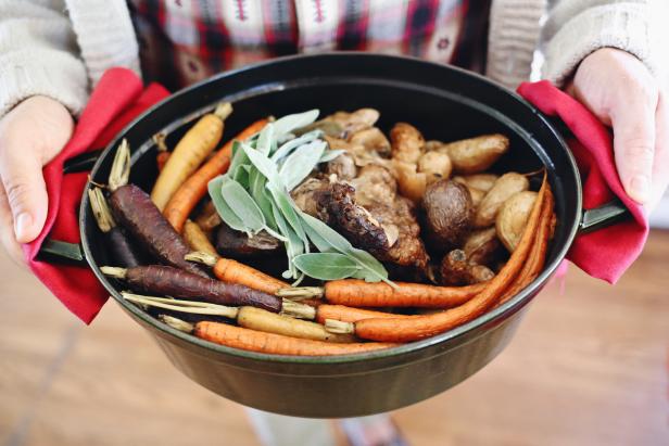 a pot of hard cider roast with fresh vegetables