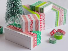 white gift boxes wrapped in Christmas themed washi tape