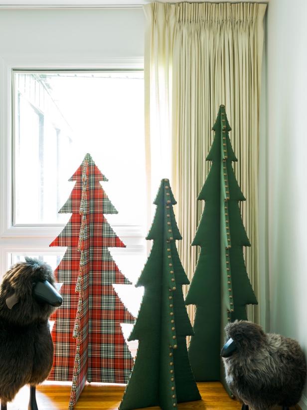 When it comes to Christmas trees, I say the more the merrier. This custom tree adds sophistication to any style holiday decor AND it's super easy to store away- so go ahead and make several! A grouping looks phenomenal!
