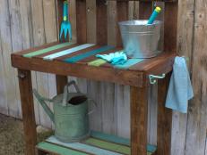 Now you're ready to place the cut pallet boards into the spaces on the potting bench top. Use a brad nailer and 1-3⁄8" brads to secure them. "You could use 1-1⁄4" screws instead," Lamb says. "Accessorize your potting bench with hooks for garden tools, gloves, towels, and a bottle opener. Finish and protect the potting bench with a clear sealer made for outdoor use." Your bench can double as a gardening space or a buffet when you're entertaining. "(It) doesn’t have to go outdoors if you have more use for it indoors—it looks great in a kitchen or entryway.”
