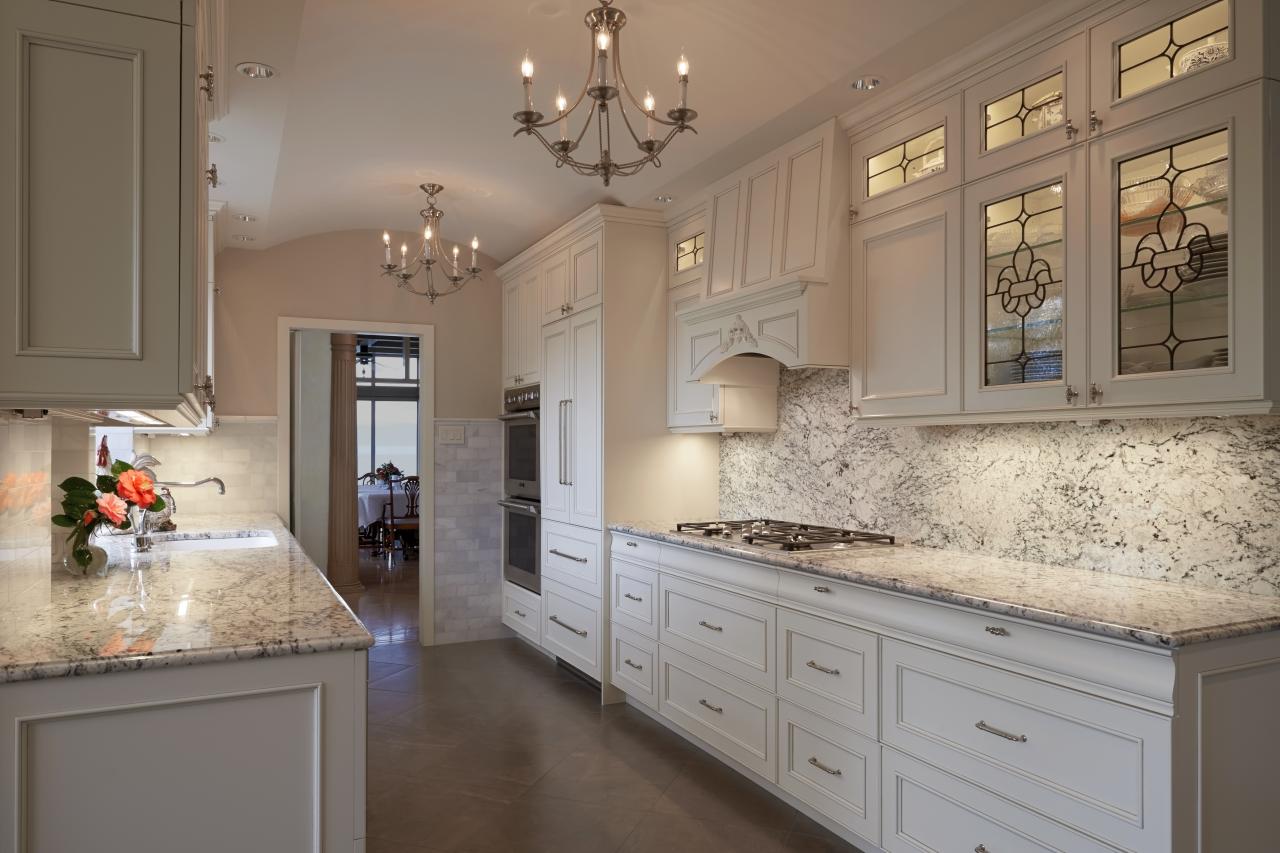 Elegant Kitchen With White Cabinets and White Ice Granite ...