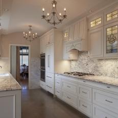 Elegant Kitchen With White Cabinets and White Ice Granite Countertops