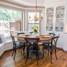 Rustic Bay Window Dining Area with Custom Benches and Cabinets