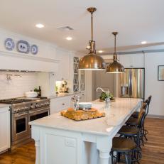 Open Concept Eat-In Kitchen with White Walls and Cabinets