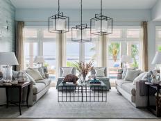 Soaring ceilings and walls of french doors define the home’s central gathering space, where Floridian style makes a sophisticated statement.