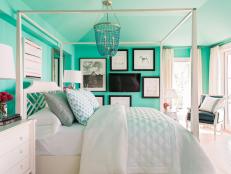 A star of HGTV Dream Home 2016, the second-floor master bedroom is a show-stopper with majestic teal walls and a lavish canopy bed.
