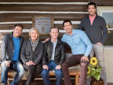 The Scott family celebrating the reveal of Scotty's guest cabin at the Bew's ranch in the foothills of the Rockies. The exterior has a new front porch featuring a new bench and staining. The interior has all new floors, furniture and appliances, as seen on Property Brothers at Home on the Ranch.
