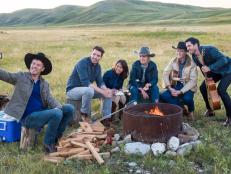 The Scott family takes a selfire around the campfire at the Bew's ranch in the foothills of the Rockies, as seen on Property Brothers at Home on the Ranch.