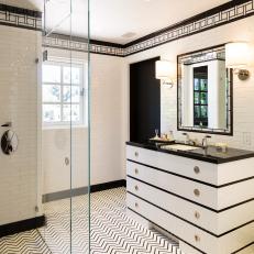 Dramatic Black and White Bathroom With Chevron-Patterned Floor