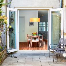 French Doors Extend Indoor Dining Area Into Private Garden