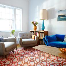 Blue and Orange Furnishings Make Modern Living Room Inviting