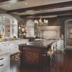 Warm, Traditional Kitchen With White and Wood Cabinetry