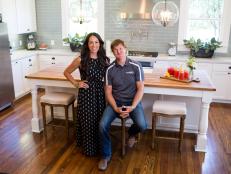 Hosts Chip and Joanna Gaines pose in the newly remodeled kitchen of the Dansby home, as seen on Fixer Upper. (portrait)