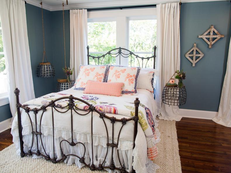 The master bedroom of the newly renovated Dansby home has been transformed with fresh paint, refubished flooring, and a clean open feel, as seen on Fixer Upper. (after)