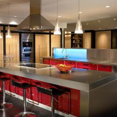 Contemporary Open Kitchen Features Bright Red Cabinets