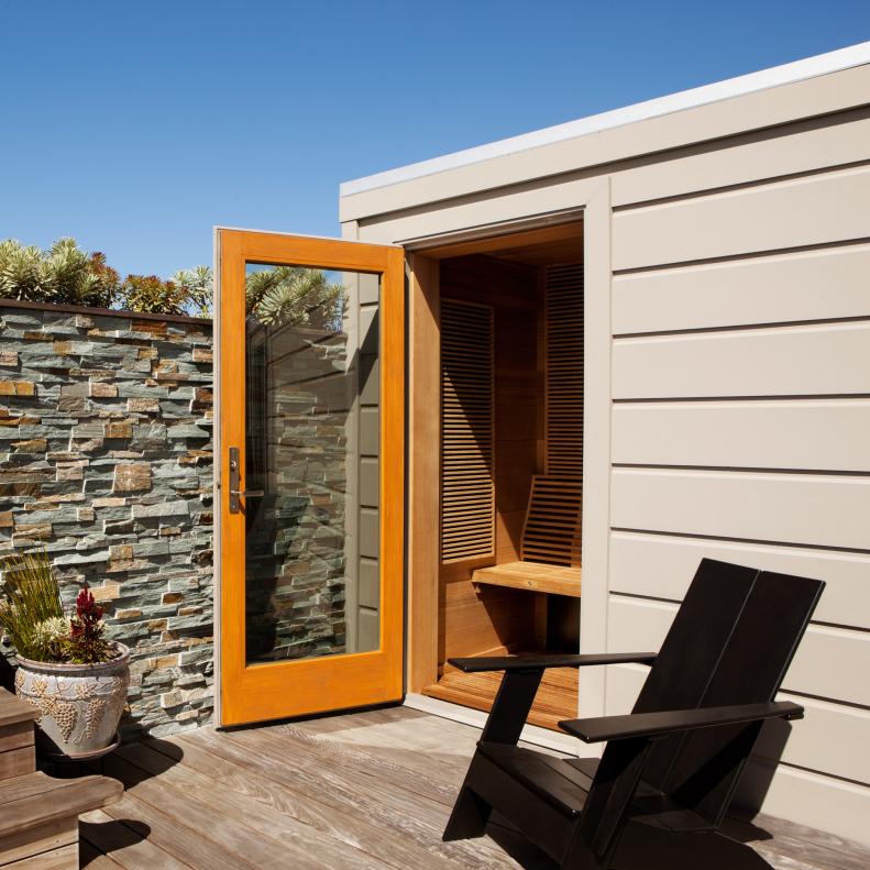 Rooftop Deck with Outdoor Sauna and Stone Wall