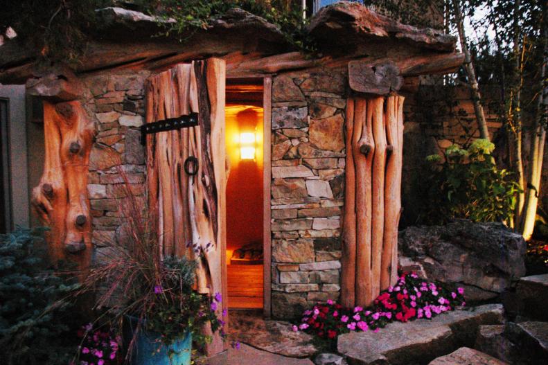 Rustic Outdoor Sauna with Stone and Timbers