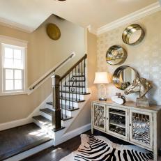 Transitional Foyer With Metallic Accents, Zebra Area Rug