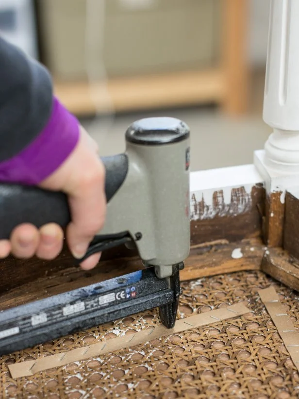 Use additional cardboard upholstery strips to secure wood seat to caning of chair seat. Staple every couple of inches until seat feels securely affixed to chair. Tip: The nice thing about this method is that the staples can be removed in the future, so seat can be detached and chair can be re-caned.