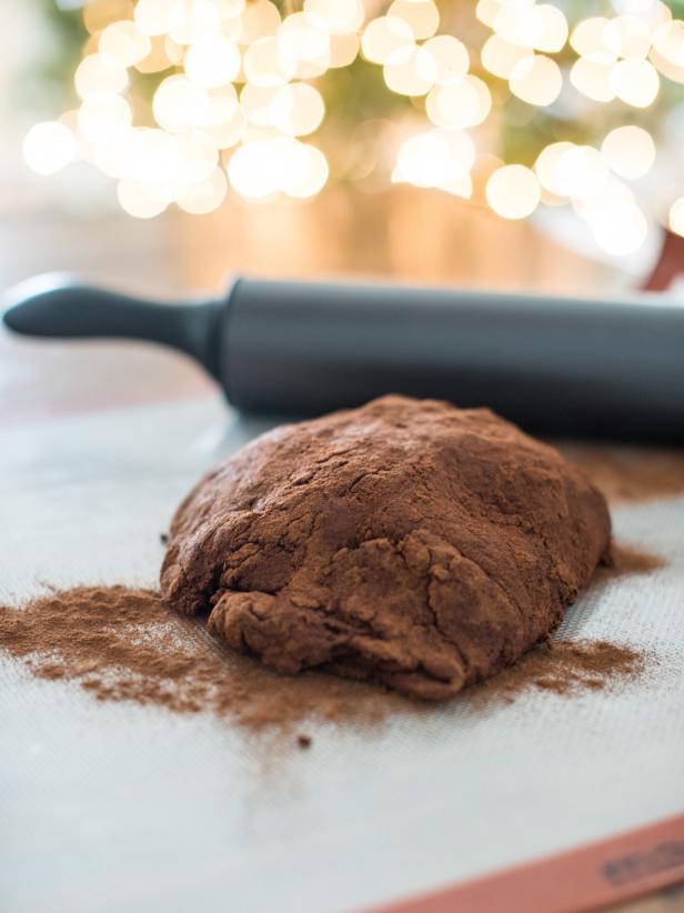 Dust dough and rolling surface with extra cinnamon to prevent it from sticking.  Roll out with a rolling pin to about ¼” thickness.
