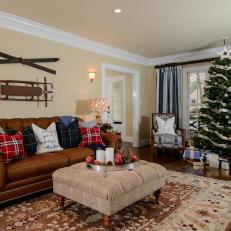 Traditional Living Room Decorated for Winter With Vintage Skis and Sled