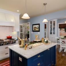 Cozy Cottage Kitchen With Royal Blue Island and Holiday Decor