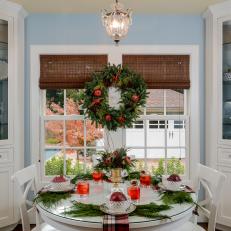 Breakfast Nook Features Fresh Greenery Trimmed With Pomegranates, Cinnamon Sticks and Pinecones