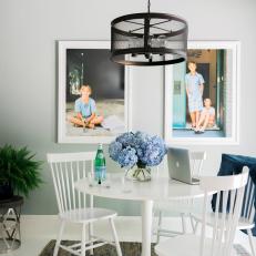 Family-Friendly Dining Nook With Large Framed Portraits