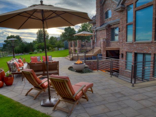 A Deck With Pavers Sun Umbrella And Fire Pit Hgtv