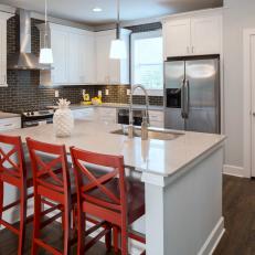 Bright, Clean Kitchen Boasts Bold Red Barstools