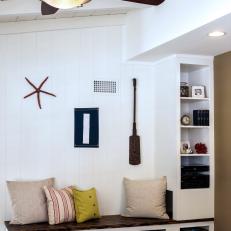 Built-in Bench Mudroom Sitting Area With Wicker Basket Storage, Coastal Details and Exposed Ceiling Beams 