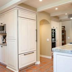French Country Kitchen Features Paneled Refrigerator