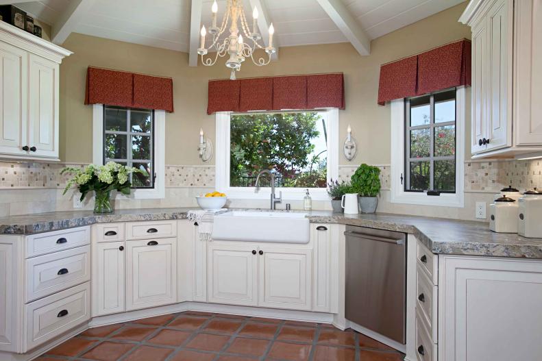 French Country Kitchen With White Cabinets, Windows and Farmhouse Sink