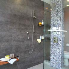 Modern Shower With Glass Room Divider, Gray Wall, Blue Tile Pillar and Floating Wood Bench 