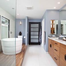 Long Asian Bathroom With Pastel Blue Walls, Frosted Glass Finishes and White Floating Bathtub 