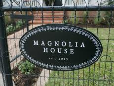 The new sign that welcomes guests into the newly renovated Magnolia House bed and breakfast, as seen on Fixer Upper. (exterior)