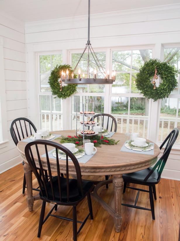 The dining table and chandelier in the kitchen of the newly renovated Magnolia House bed and breakfast, as seen on Fixer Upper. (after)