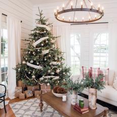 Christmas Tree With Ribbon Garland in Festive Living Room