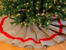 The tree skirt is placed around the tree.