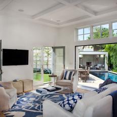White and Blue Coastal Sitting Room With Lucite Table