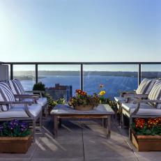 Rooftop Patio With Chairs and Water View